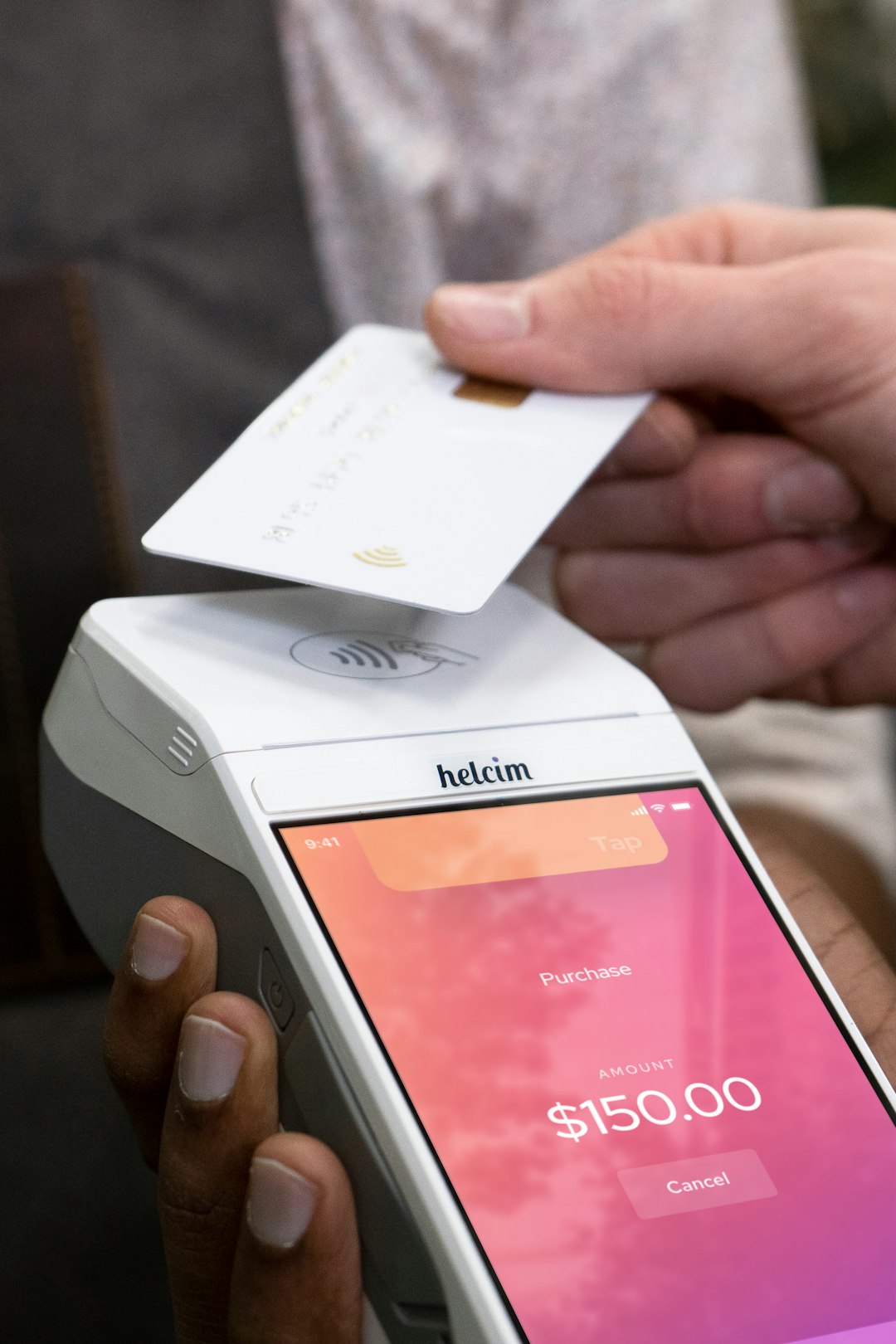 Amerchant taking a payment with a POS machine